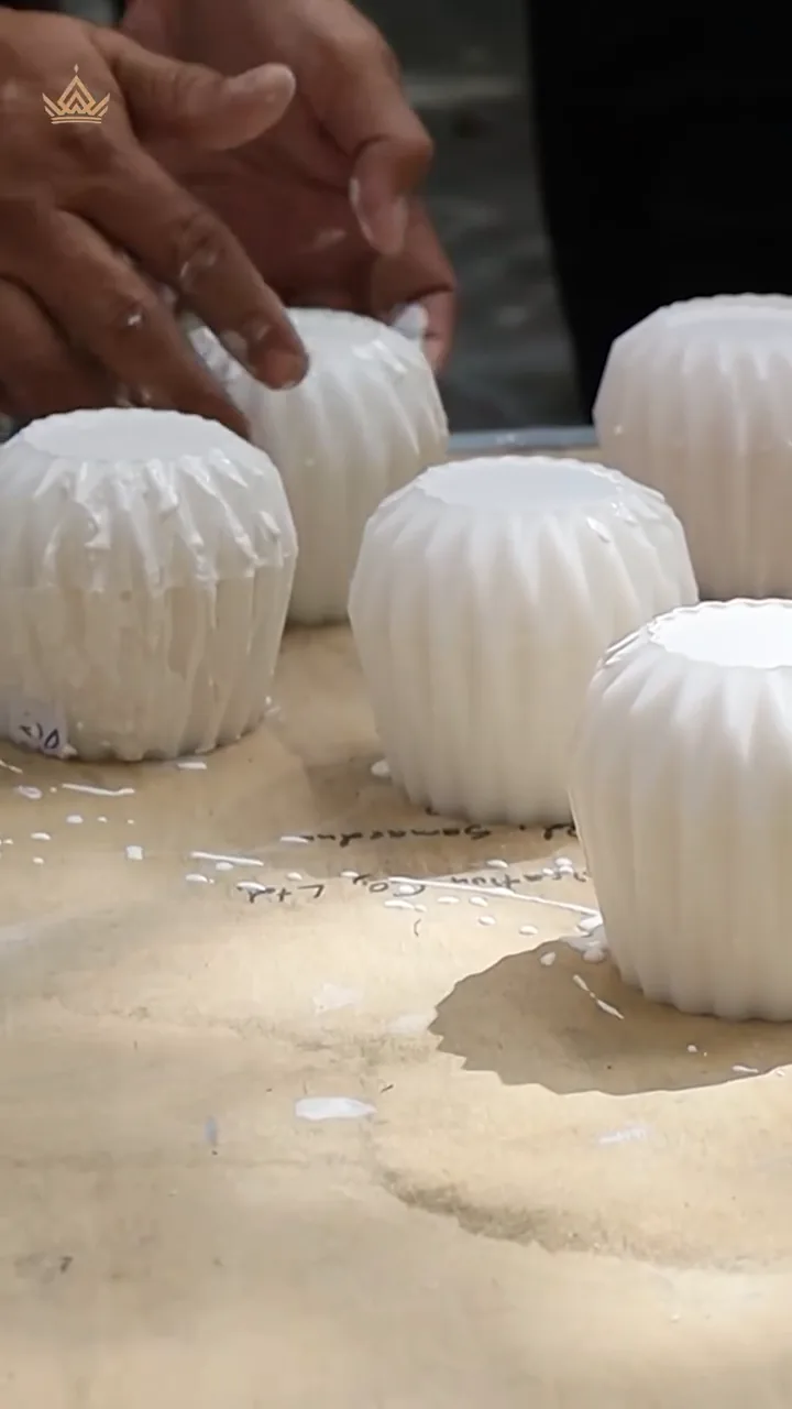 Freshly cast mussel shell pots on the work table