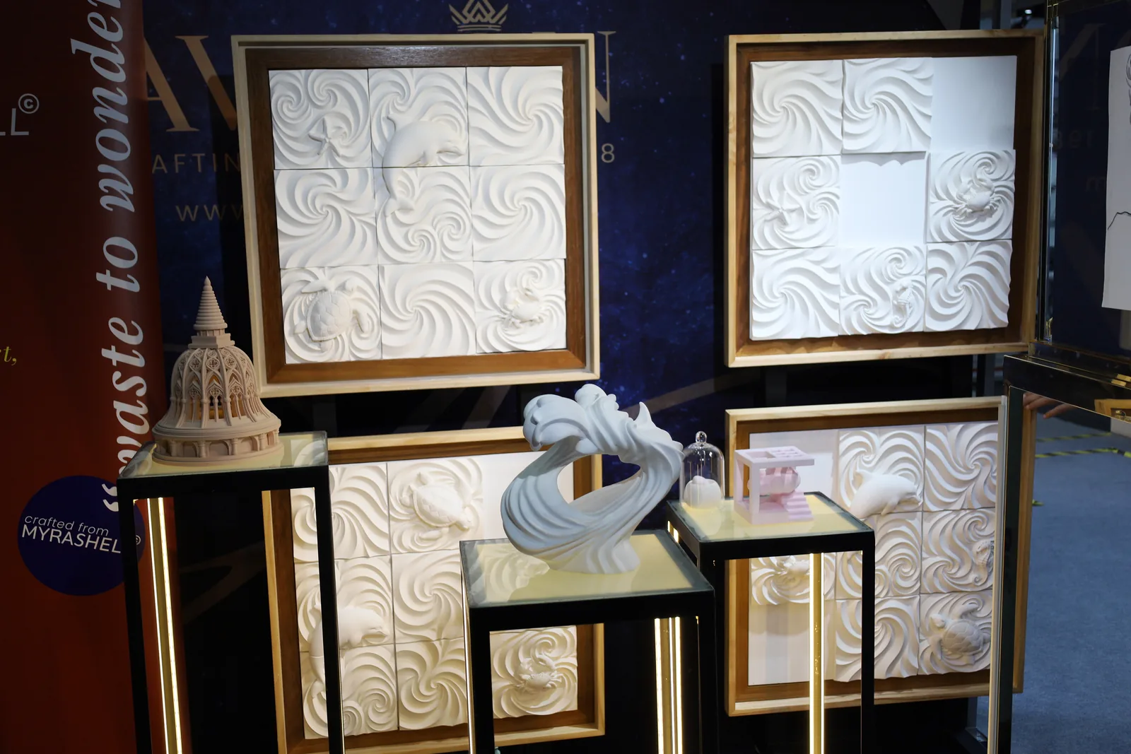 MyraShell reliefs in frames beside the From Waste to Wonder panel
