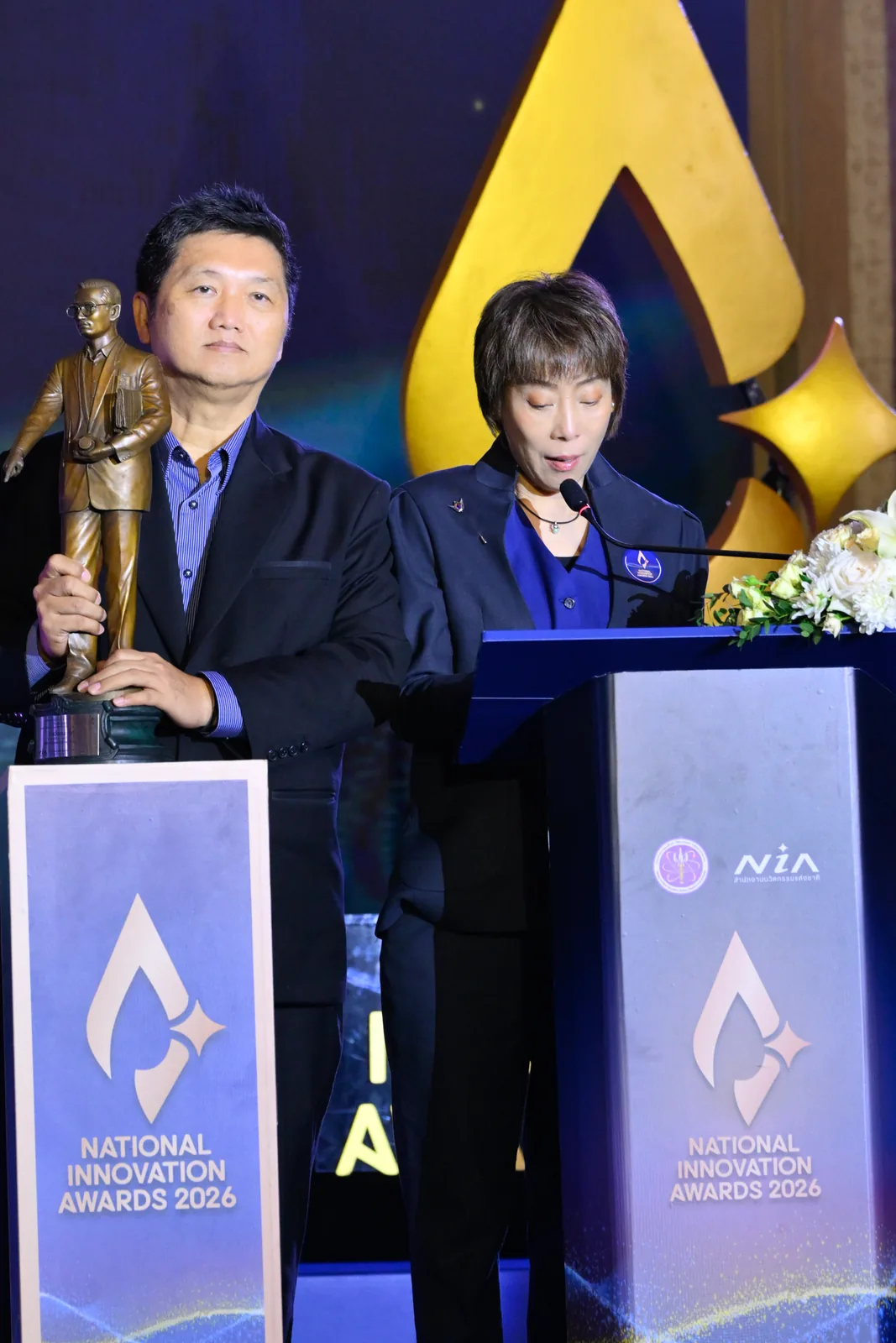 The company team at the podium with the award