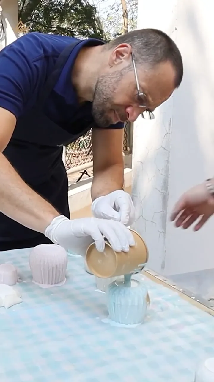 Pouring the shell mix into a mould
