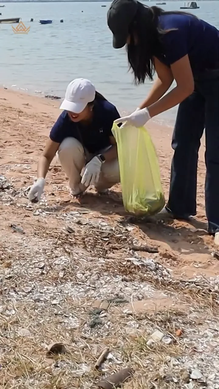 Picking up litter along the shore