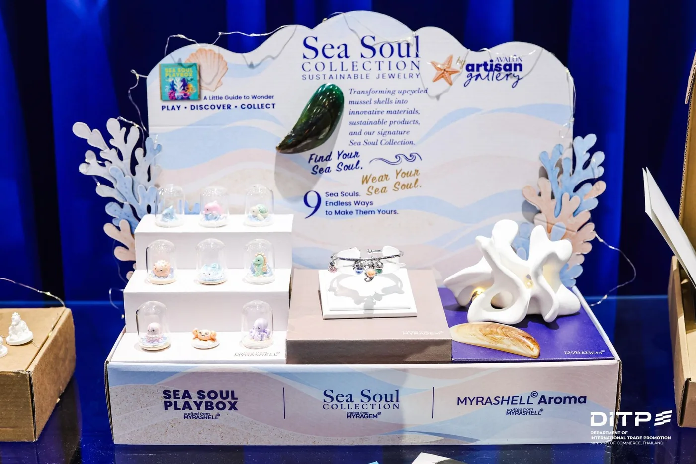 Our Sea Soul Collection display at the Bangkok Showroom Jewelry Showcase, with Sea Soul Playbox figures, a Sea Soul bangle and MyraShell Aroma