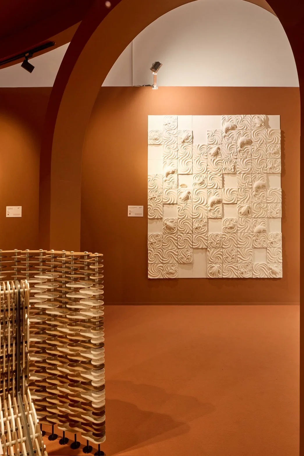 Sea of Love on the terracotta wall inside the arched room at Superstudio