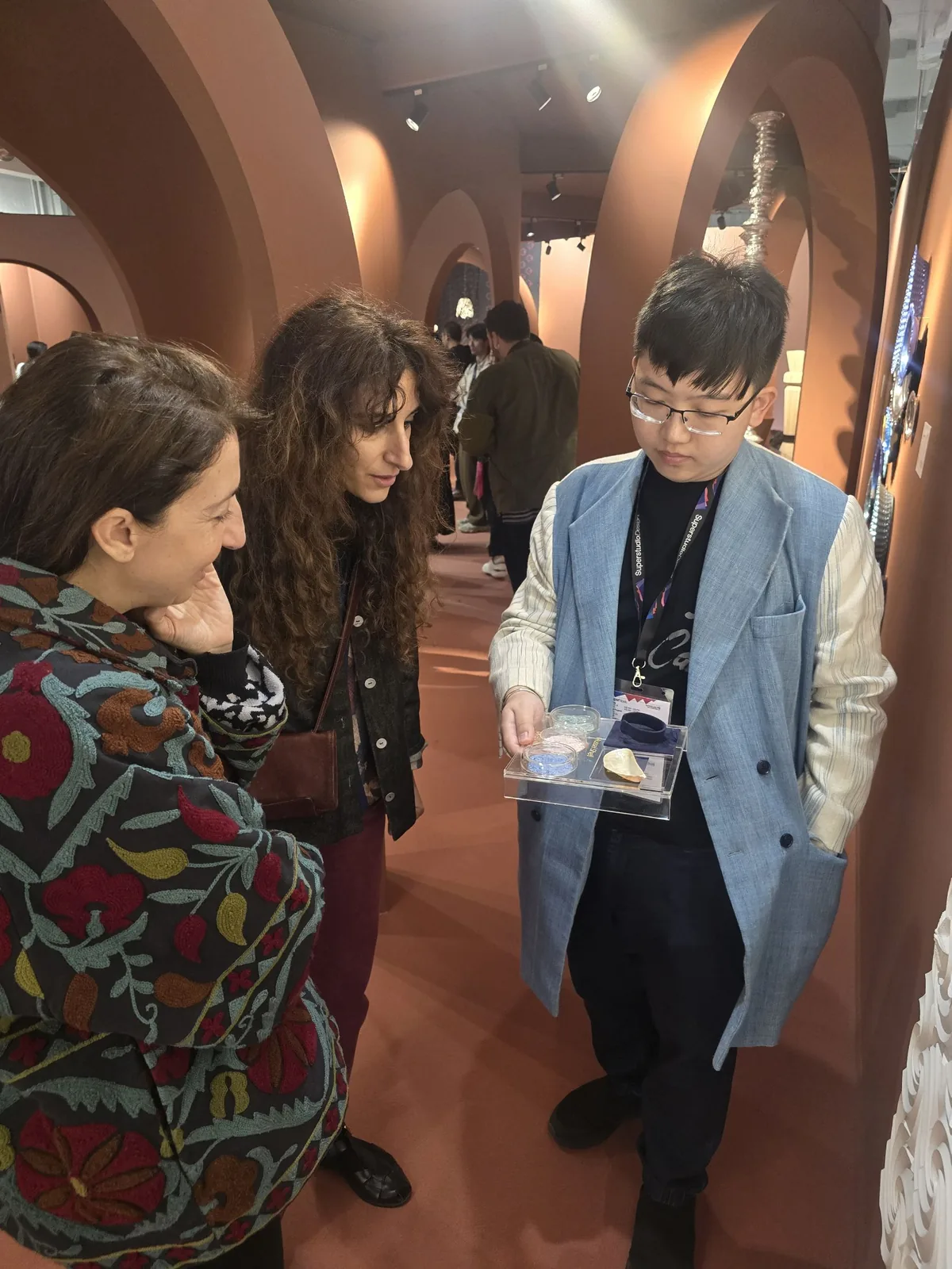 Our team shows a MyraShell sample to visitors beside the wall