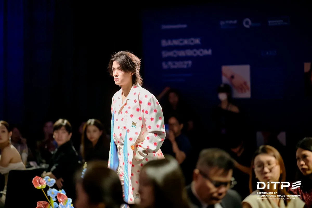 A model in a floral jacket on the runway