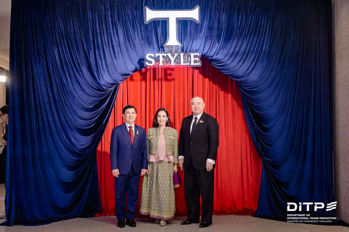 Guests posing in front of the T-STYLE curtain